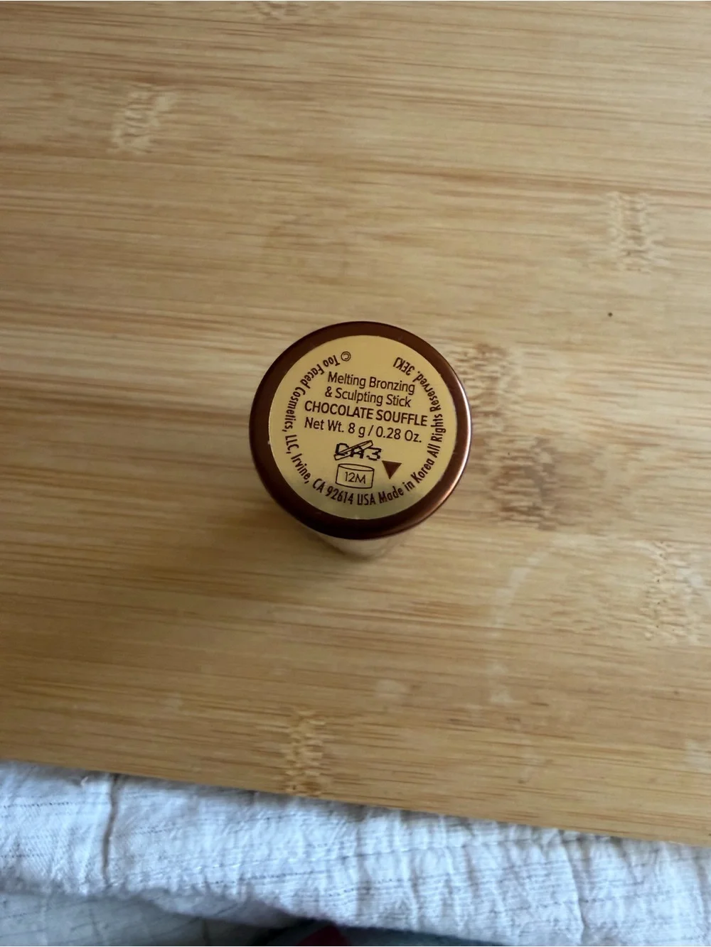 Too Faced melting, and bronzing sculpting stick swatched once